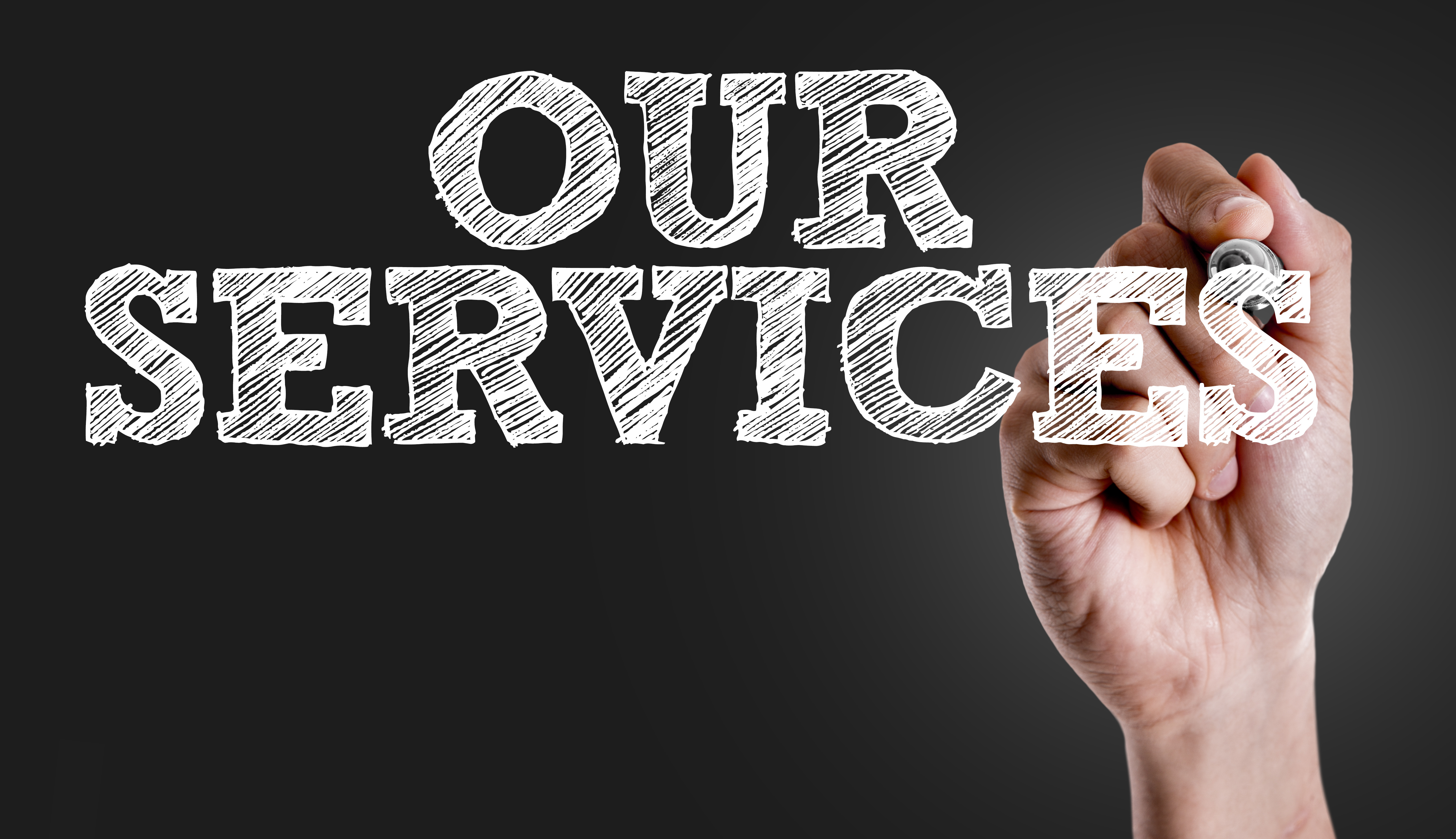 Hand writing the text: Our Services
